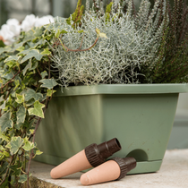 Zoom jardinière d'automne avec des arroseurs autonomes en céramique