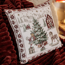 Un coussin avec des dessins de Noël