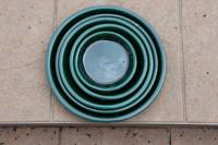 Visuel 1 du produit Soucoupe en terre cuite émaillée coloris jade Les Poteries d'Albi - Ø 33 x H 4 cm