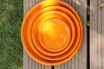 Visuel 1 du produit Soucoupe en terre cuite émaillée coloris orange savane Les Poteries d'Albi - Ø 14 x H 2 cm