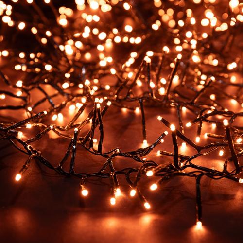 Visuel 1 du produit Guirlande lumineuse grappe à 600 LED cuivre sur câble vert Flicker Light® - 8 m