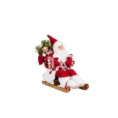 Visuel 1 du produit Père Noël décoratif Rubineige sur une luge avec hotte en polyester coloris rouge et blanc - H 30 cm